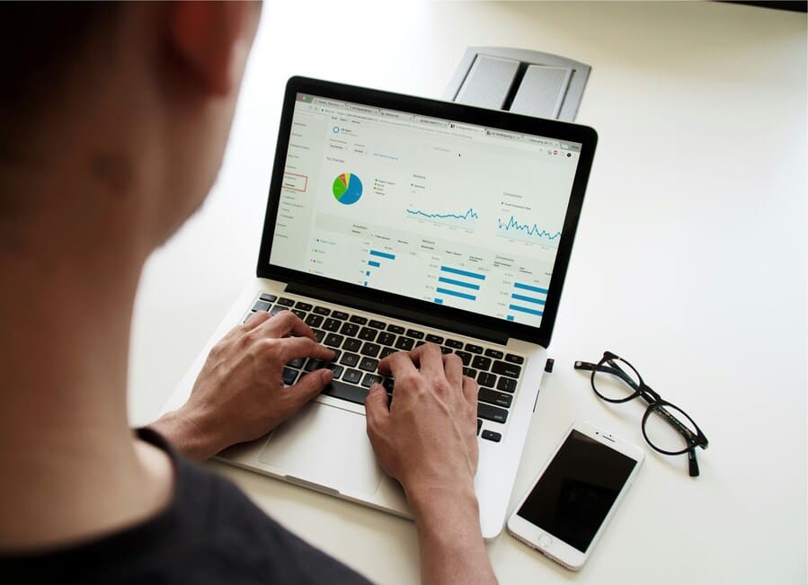 A financial advisor working on a computer.